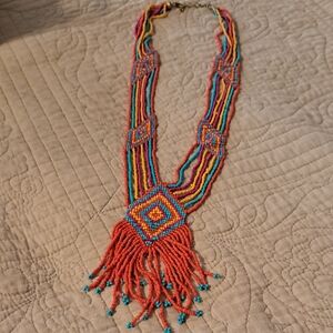 Hand Crafted Red and Blue Beaded Necklace with Intricate Patterns